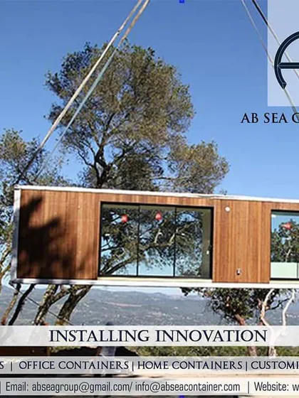 Beyond logistics, I deliver innovation by fabricating custom container structures. Here, a crane installs a modern, modular container home, showcasing how I turn a client's vision for a portable office, shop, or living space into a tangible, high-quality reality.