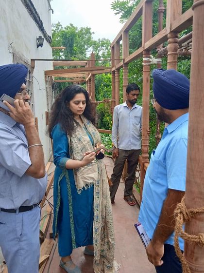 Another on-site discussion during the balcony restoration, ensuring every detail aligns with our conservation plan and the client's vision.