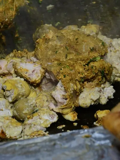 Our chefs preparing a fresh batch of bheja fry on the hot tawa. This is one of our most popular dishes, loved for its authentic taste and texture.