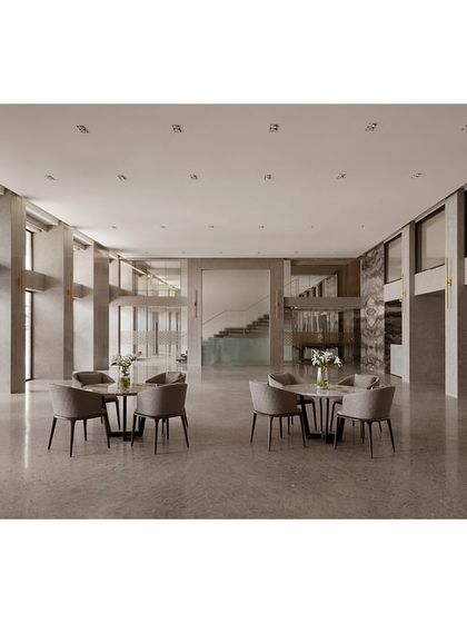 The transformed banquet space at Blue Sea, featuring new wall cladding and a redesigned ceiling. The area under the mezzanine was repurposed for informal meetings, with mirrored paneling to enhance the sense of space.