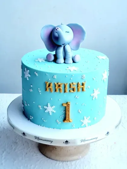 Another view of the baby elephant first birthday cake.