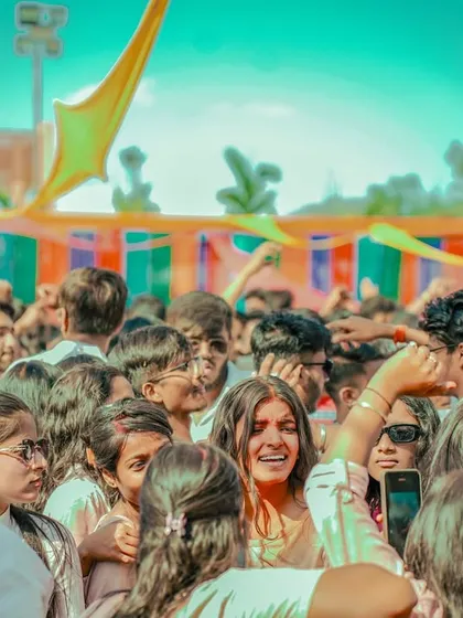 Interacting with fans in the crowd during the Holi party in Ranchi.