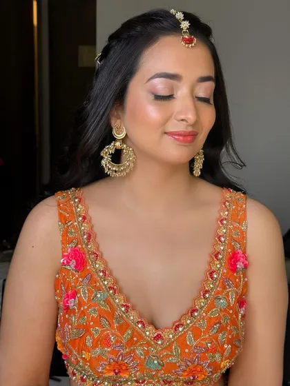 With eyes closed, you can see the soft, shimmery eyeshadow. It adds a touch of glam without being too heavy for a daytime event.