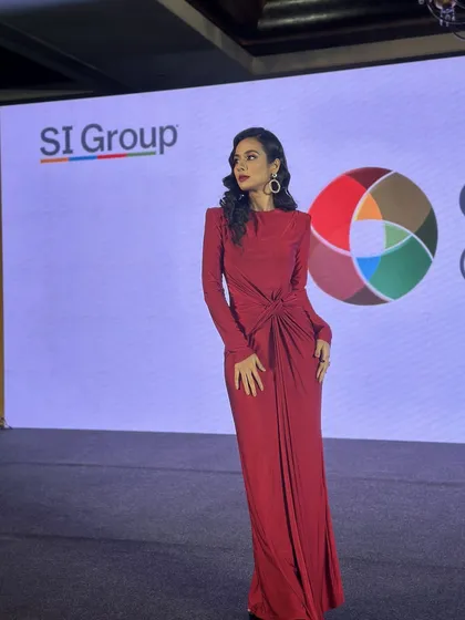 Another angle from the corporate event, showcasing how the makeup and hair look from the side. The classic waves and defined makeup profile beautifully on camera, ensuring a polished look from every view.