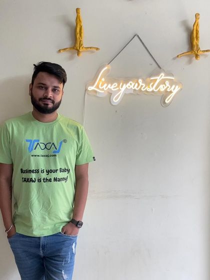 Sporting my company's T-shirt with our tagline: "Business is your baby, TAXAJ is the Nanny!". It's a simple way to say that I take care of the details so you can focus on your vision.