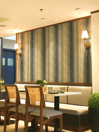 The elegant interior of our 5th restaurant in Khan Market, Delhi. The soothing color palette and comfortable booth seating make it a perfect spot for a relaxed meal.