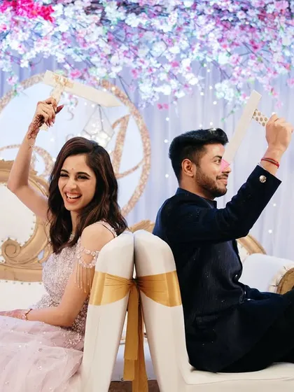 Capturing the fun and games that make an engagement party memorable. This shoe game moment is filled with laughter and personality.