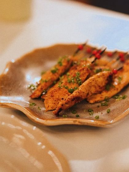 A simple plate of perfectly seasoned and cooked fish, garnished with fresh herbs. This was part of a scenic brand launch event I curated.