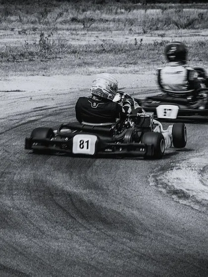 A black and white shot of our drivers cornering, highlighting the raw action of the sport.