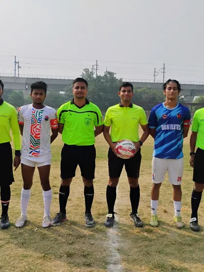 The captains with the match officials before kick-off in the HCL Youth League.