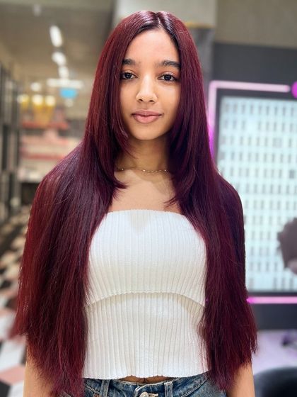 Another shot of this stunning red hair. The color is pure and vibrant, a testament to the quality of Redken color.