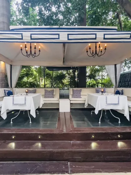 Our grandest cabana, set up for a larger group to enjoy lunch. The dual chandeliers and ample seating make it a perfect spot for a special celebration.