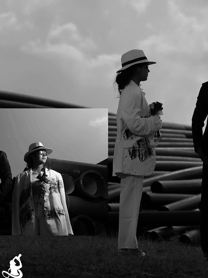 A modern and edgy pre-wedding collage with a black and white theme, set against an industrial background of large pipes.