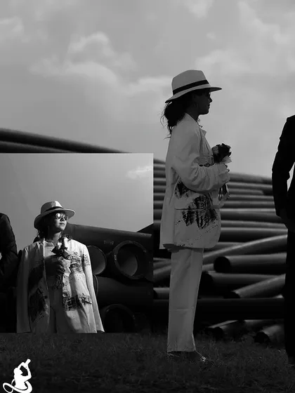 A modern and edgy pre-wedding collage with a black and white theme, set against an industrial background of large pipes.