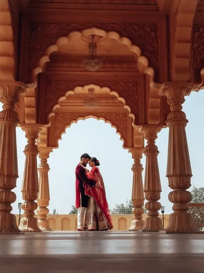 A timeless portrait framed by magnificent palace arches. This shot is all about creating a sense of grandeur and royal elegance, making you feel like the main characters in your own epic love story.