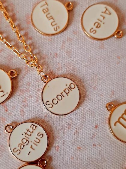 A collection of my best-selling zodiac watch charms. These white and gold enamel charms are a stylish way to represent your star sign.