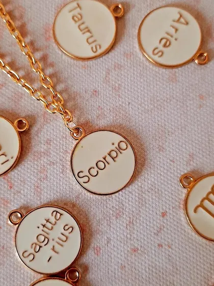 A collection of my best-selling zodiac watch charms. These white and gold enamel charms are a stylish way to represent your star sign.