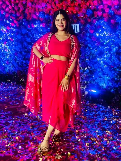 Posing against a beautiful blue and purple floral wall. The lighting at evening events creates such a magical atmosphere.