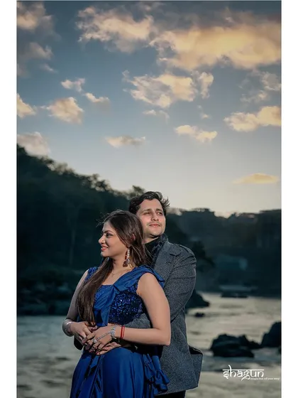 A classic romantic embrace with the river and evening sky as the backdrop. This shot captures the peaceful end of a beautiful day in Rishikesh.