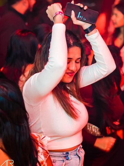 A guest lost in the music on the dance floor.