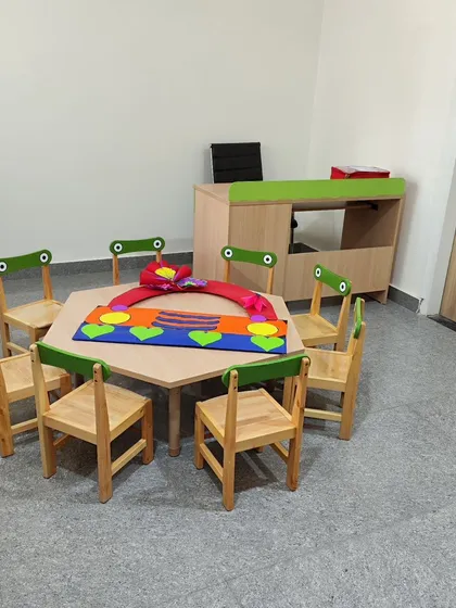 We designed this custom hexagonal table and chairs specifically for group activities. The design encourages interaction and collaboration, and the materials are durable and safe for a play school environment.