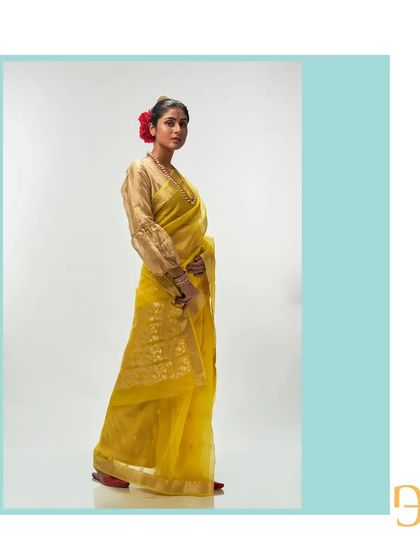 The side profile highlights the intricate floral motif on the pallu.