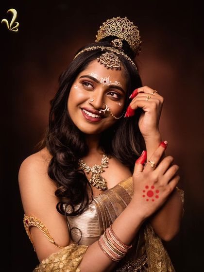 A close-up on the details of the Shailaputri look. The traditional alta on the hands and forehead contrasts with the modern gown, showing how I blend traditional and contemporary elements to create a unique, meaningful style.