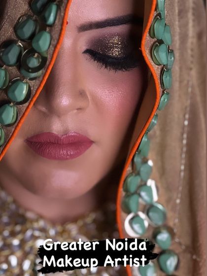 A close up of a smokey glitter eye look. This is a popular choice for brides who want a glamorous and dramatic look.