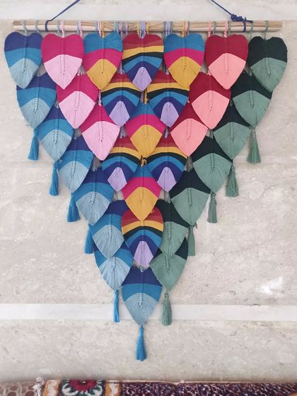 This was one of our biggest and most challenging macrame leaf hangings. The planning and effort were totally worth it to create this beautiful, large-scale rainbow ombre piece.