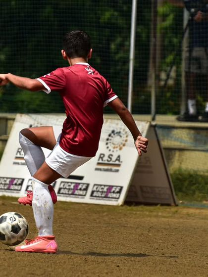 A player displays fancy footwork to control the ball during the RSA Cup. Technical skill is a cornerstone of our training.