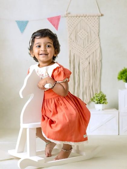 My boho-themed sessions use natural textures like macrame, wood, and greenery to create a calm and earthy setting that beautifully complements your child's simple joy.