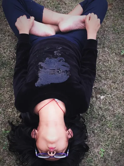 A young girl practices Matsyasana, the fish pose, during our half day Christmas retreat for kids and parents.