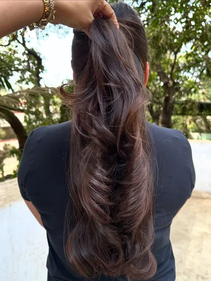 Her first hair color, and we went with a beautiful 'Cocoa Bean' shade. This is a great choice for a first-timer, as it's a subtle, rich brown that enhances natural hair color without being too dramatic.