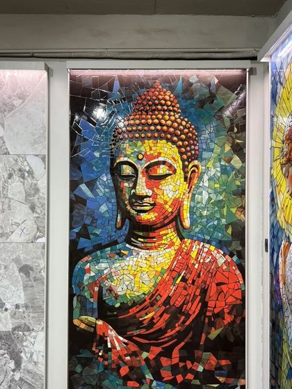 Another example of our stunning mosaic murals. This colorful Buddha artwork can be a focal point for both indoor and outdoor spaces.