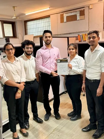 The full team congratulating another successful intern. This demonstrates the supportive and celebratory culture that is a core part of the Nirwan Legal experience.