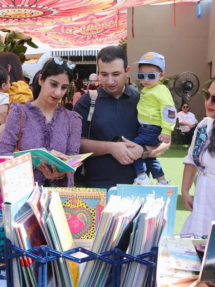 A family exploring the books at my stall. It’s always wonderful to see parents and children discovering new stories together.