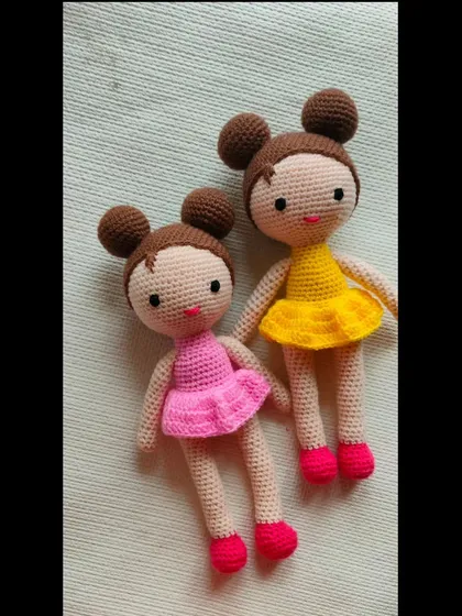 Two beautiful dolls in one frame. One is in a pink dress and the other in a yellow dress. A pretty gift for sisters or best friends.