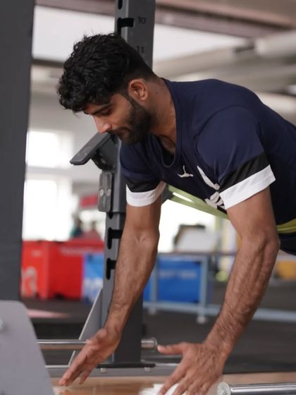 An athlete works on an anti-rotation core exercise. Building a strong, stable core is a priority.