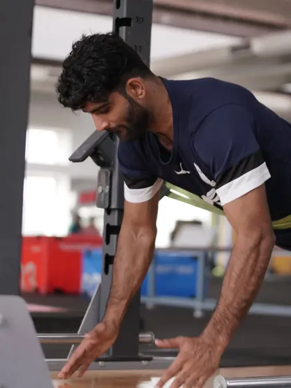 An athlete works on an anti-rotation core exercise. Building a strong, stable core is a priority.