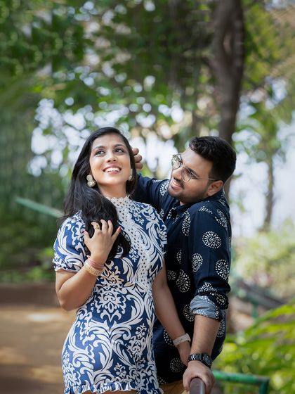 A playful and loving moment captured in a lush, green park. I aim to capture the natural interactions that show a couple's true connection.