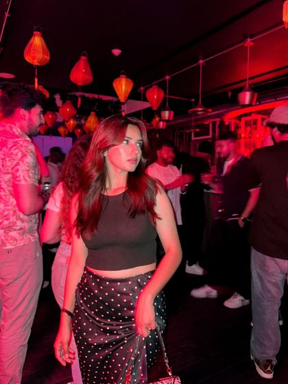 A candid shot of me in a crowded bar, capturing the lively atmosphere.