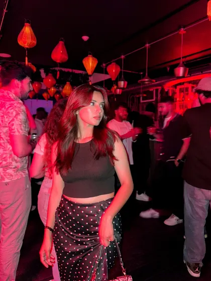 A candid shot of me in a crowded bar, capturing the lively atmosphere.