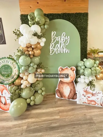 Another angle of the woodland "Baby Bloom" setup, showing the arrangement of the character cutouts and the detailed balloon work. This theme is perfect for a gender-neutral and elegant baby shower.