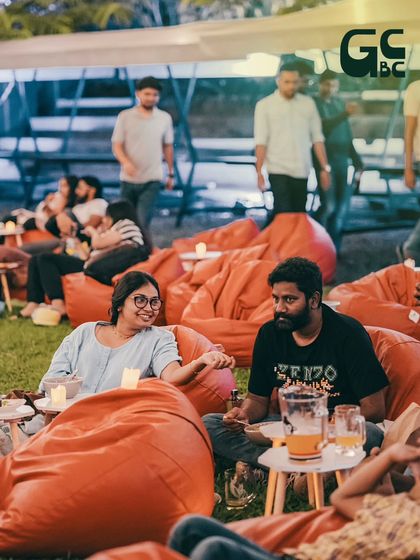 More happy guests relaxing on beanbags, sharing drinks and conversation. This is the community vibe I love to see.