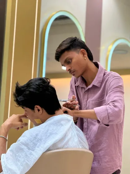 Precision is key. Our stylist uses the scissor-over-comb technique to ensure a perfectly blended and clean neckline, a crucial step for any quality men's haircut.