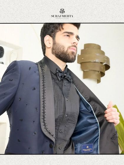 A glimpse of the fine interior lining of the navy blue tuxedo. My commitment to quality is evident inside and out, with a smooth satin lining ensuring comfort and a perfect drape.