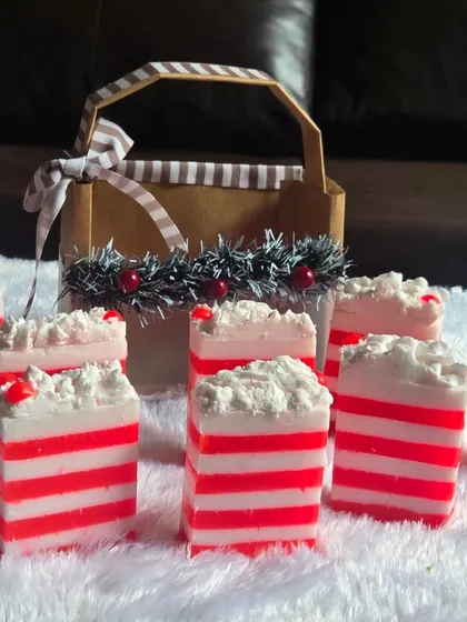 A festive collection of my red and white striped Christmas soaps, ready to be packed into gift baskets. These are made with a gentle, paraben-free base.