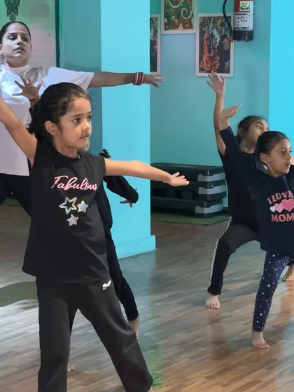 A group of young dancers learning to move in unison. The focus and teamwork in our beginner classes are wonderful to see.