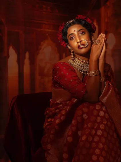 Another angle of this dramatic festive look, showing the beautiful details of the saree and jewellery.