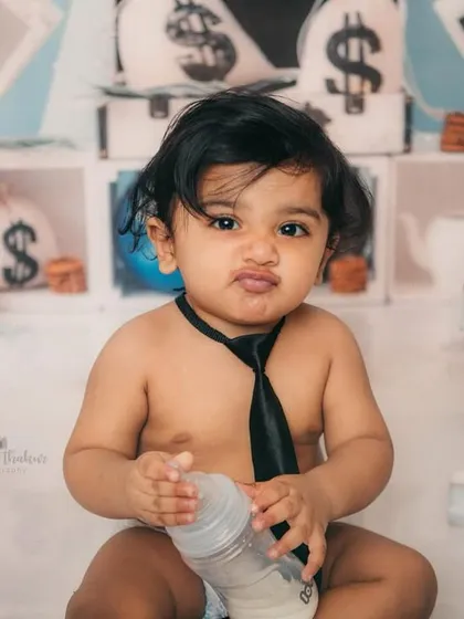 Making a deal or just making a funny face? This little boss baby has the expressions down perfectly for his first birthday shoot.